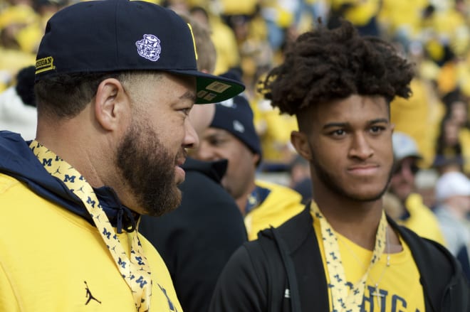 2024 Charlotte (N.C.) Providence Day three-star wide receiver Channing Goodwin and father Jonathan Goodwin.