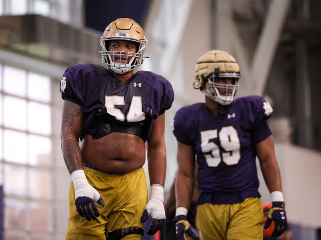 Notre Dame right tackle Blake Fisher (left) trimmed down his body fat during the offseason.
