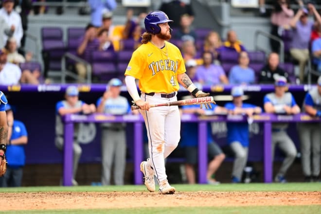 LSU third baseman Tommy White begins a slow eighth-inning walk to first base after he was hit by a bases-loaded pitch that scored what proved to be the game-winning run vs. Kentucky.  