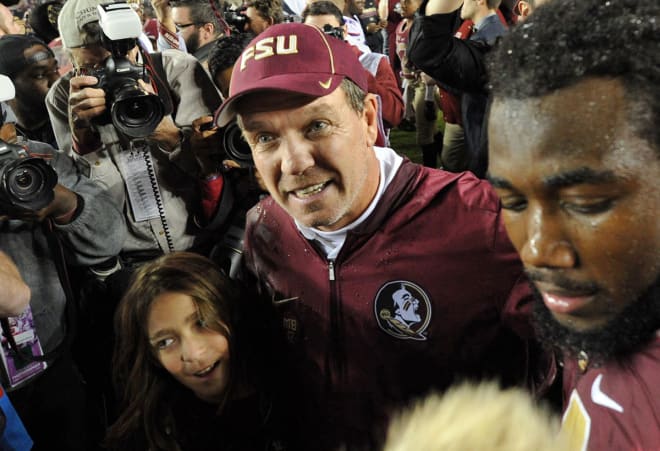 Jimbo Fisher, his son Ethan and tailback Dalvin Cook walk off the field after Saturday's win.