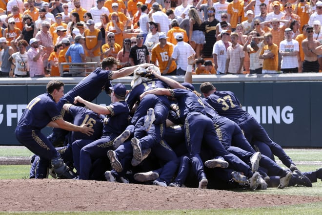 Notre Dame baseball players dogpile after knocking off No. 1 Tennessee earlier this month.