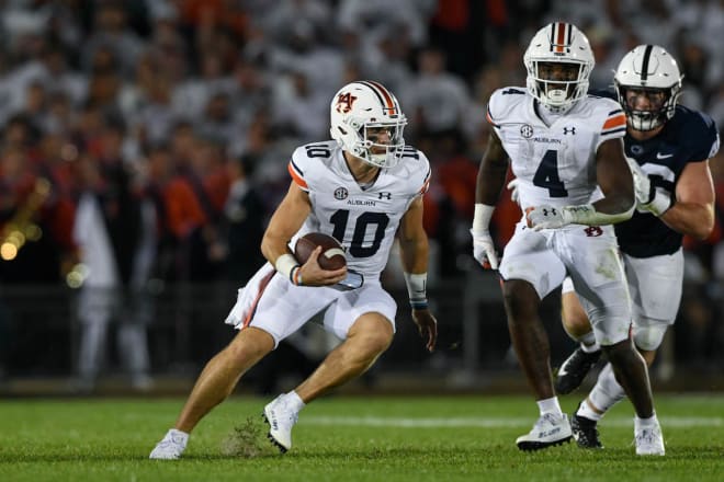 Bo Nix looks for running room against Penn State.