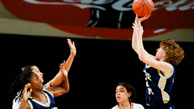 Beth Morgan Cunningham (shooting) and Katryna Gaither (left) led Notre Dame's rise and to its first Final Four.