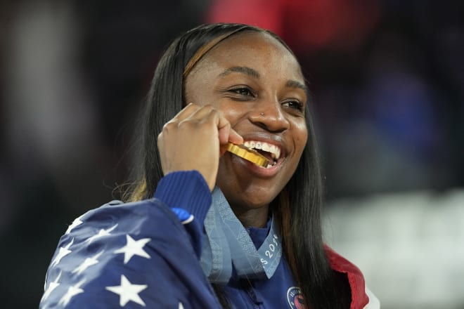 Former Notre Dame women's basketball star Jackie Young celebrates Sunday after Team USA edged France for the Olympic gold medal.