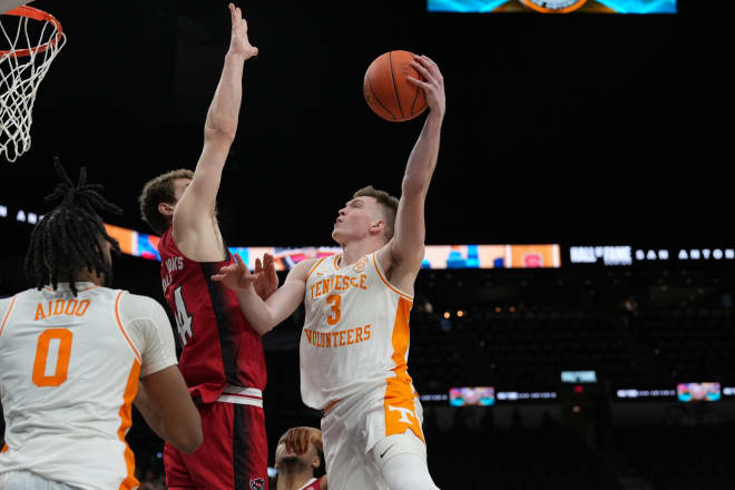 Dec 16, 2023; San Antonio, Texas, USA; Tennessee Volunteers guard Dalton Knecht (3) shoots over North Carolina State Wolfpack forward Ben Middlebrooks (34) in the second half at the Frost Bank Center.