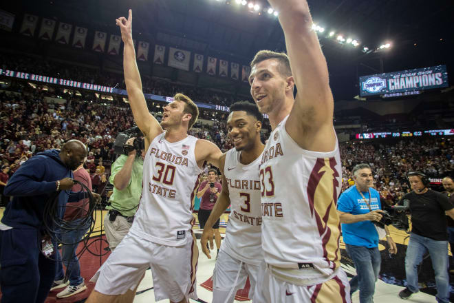 Walk-ons Harrison Prieto (left) and Will Miles (right) celebrate last year's ACC title-clinching victory against Boston College with former teammate Trent Forrest.