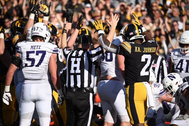 Kaleb Johnson and teammates celebrate as Spencer Petras scores a touchdown against Northwestern.