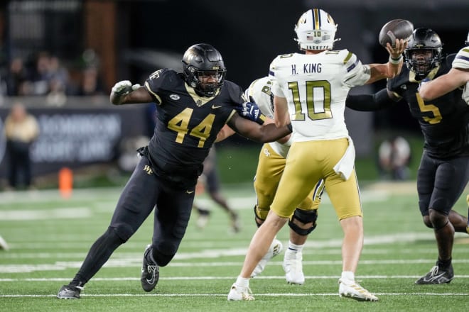 Justin Cody, left, pressures Georgia Tech quarterback Haynes King during last season's game. 