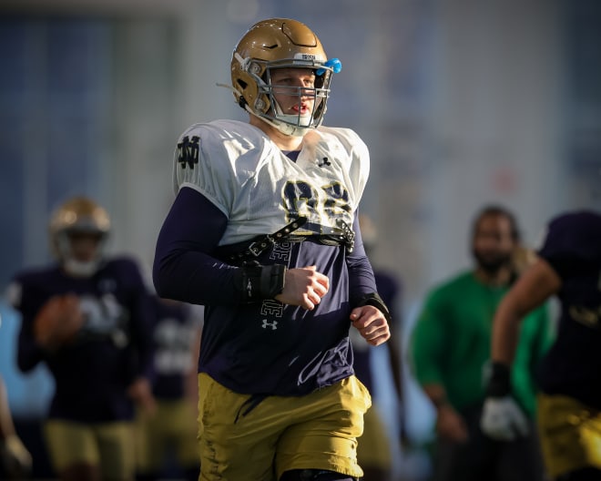 Notre Dame defensive linemen Rylie Mills warms up at a recent Irish spring practice.
