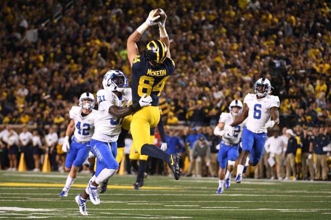 Michigan tight end Sean McKeon rises high for a catch in the 40-21 win over Middle Tennessee State.