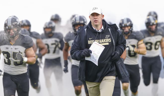 Head coach Jeff Brohm of the Purdue Boilermakers runs out with the team before the game against the Illinois Fighting Illini at Ross-Ade Stadium on November 4, 2017 in West Lafayette, Indiana.