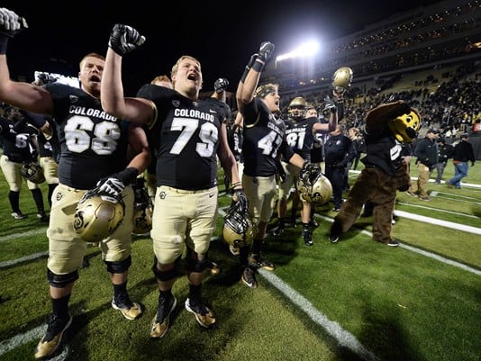 Buffs players celebrate last year's 20-10 win over UCLA at Folsom Field.