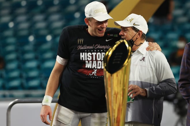 Alabama Crimson Tide quarterback Mac Jones celebrates with head coach Nick Saban following Monday night's national championship win over Ohio State. Photo | Getty Images