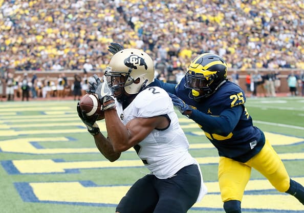 ANN ARBOR, MI - SEPTEMBER 17: Wide receiver Devin Ross #2 of the Colorado Buffaloes catches a touchdown pass in front of safety Dymonte Thomas #25 of the Michigan Wolverines during the first quarter at Michigan Stadium on September 17, 2016 in Ann Arbor, Michigan. (Photo by Duane Burleson/Getty Images)