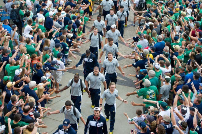 Notre Dame Fighting Irish players walking to the stadium before a game