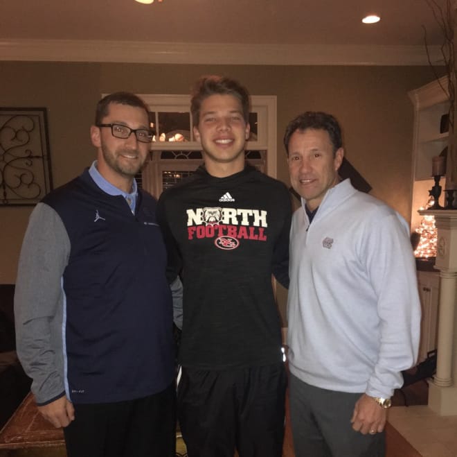 Ketih Heckendorf, Cade Fortin and Larry Fedora on Wednesday night.