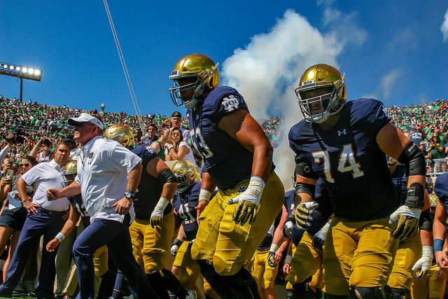 Notre Dame football runs out of the tunnel. 