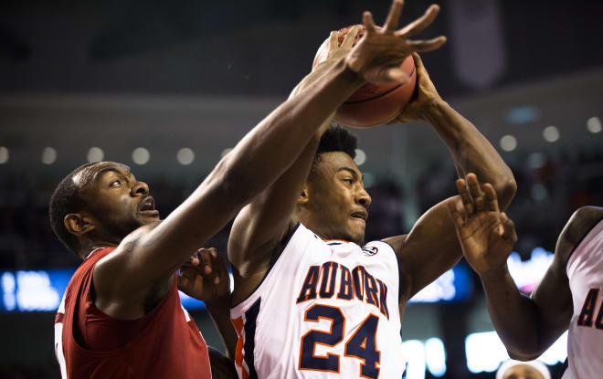 Auburn's Afernee McLemore grabs a rebound over Alabama's Jimmie Taylor (10) during an NCAA college basketball gamed, Saturday, Jan. 21, 2017, in Auburn. 