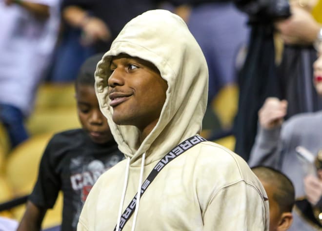 Tony Johnson watches UCF beat Memphis during his official visit in February.