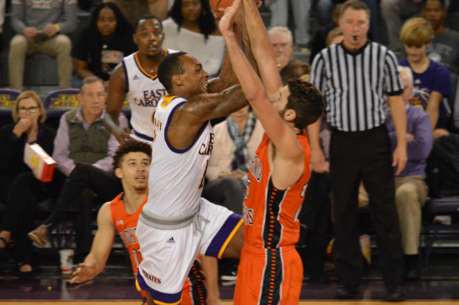 Kentrell Barkley drives in for two of his 14 points on Campbell's Andrew Eudy in ECU's 69-66 win Monday night.