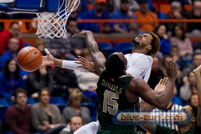 Colorado State forward, Tiel Daniels (15) fouls Boise State's James Webb III as he goes to the hoop for a basket. 