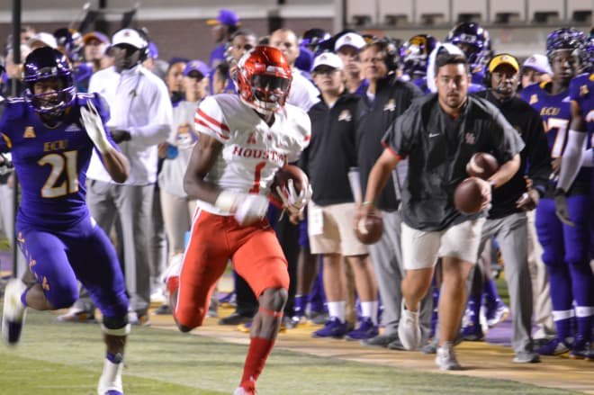 Houston's Bryson Smith scampers for 33 yards past ECU's Ray Tillman on this run in a 42-20 win over ECU Saturday night.