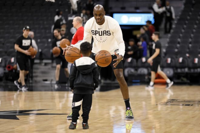 San Antonio Spurs small forward Quincy Pondexter (behind) plays with 5-year-old son, Carter, prior to the game against the New Orleans Pelicans at AT&T Center. Photo Credit: Soobum Im-USA TODAY Sports