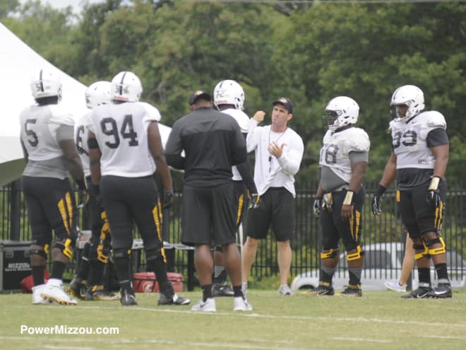 Walter Palmore (99, far right) practiced with the Tiger defensive line Monday morning
