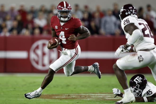 Alabama Crimson Tide quarterback Jalen Milroe (4) scrambles for yardage against the Texas A&M Aggies during the first half at Bryant-Denny Stadium. Photo | Butch Dill-USA TODAY Sports