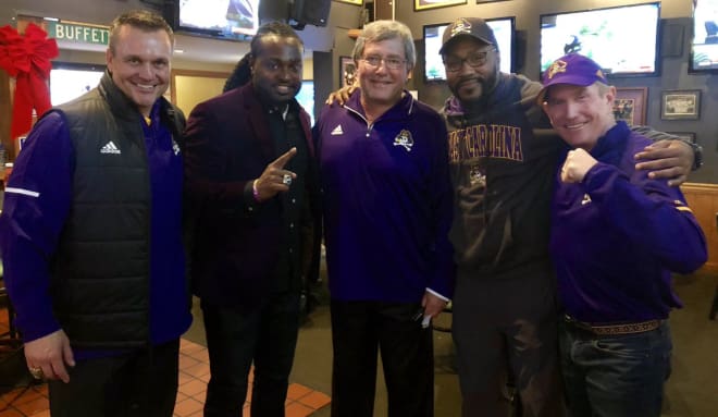 New ECU offensive line coach Steve Shankweiler (center) pictured recently at a local gathering after his return to Greenville. Also pictured is new ECU head coach Mike Houston(far left), former ECU defensive back Dekota Marshall, former ECU linebacker and defensive analyst Brandon Simmons and ECU assistant AD Matt Maloney.