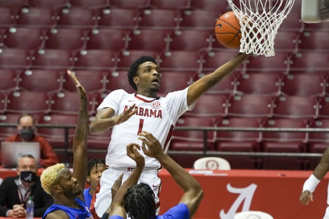 Alabama Crimson Tide forward Herbert Jones (1) goes to the basket against Florida Gators guard Scottie Lewis (23) during the second half at Coleman Coliseum. Photo | Imagn