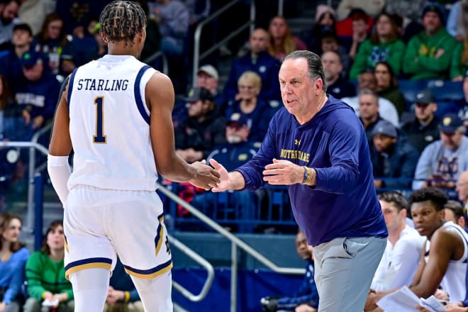 Notre Dame coach Mike Brey (right) has a word with freshman JJ Starling (1) during a 59-43 Irish victory on Tuesday night.