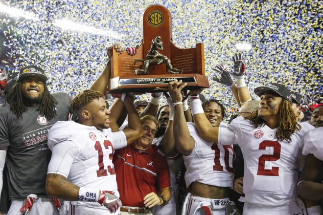 Alabama Crimson Tide head coach Nick Saban celebrates winning the trophy with his team after the SEC Championship college football game against the Florida Gators at Georgia Dome. Alabama defeated Florida 54-16. Photo | USA Today