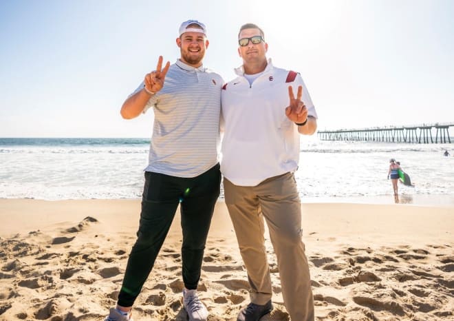 New USC OL addition Cooper Lovelace with Trojans OC/OL coach Josh Henson during his official visit.
