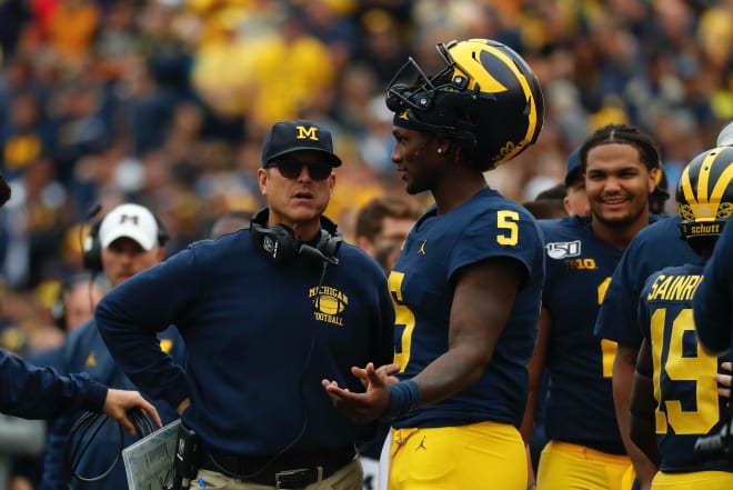 Michigan Wolverines football coach Jim Harbaugh (left) and Joe Milton