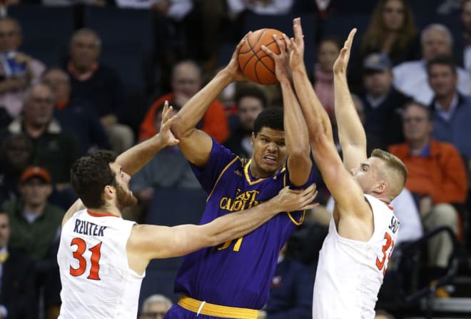 East Carolina's Andre Washington is double teamed by Virginia's Jered Reuter and Jack Salt.