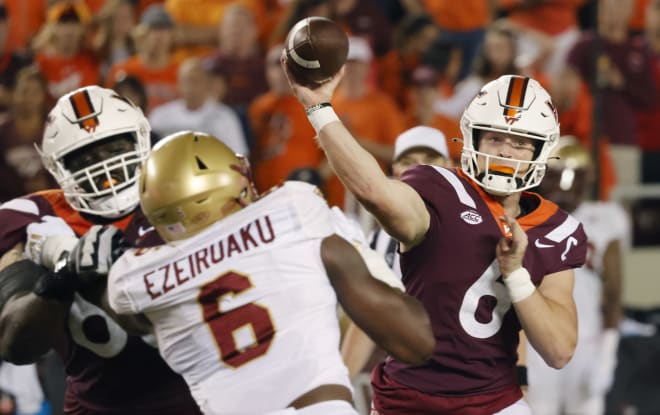 Boston College sophomore defensive lineman Donovan Ezeiruaku (6, left) pressures Virginia Tech quarterback Grant Wells on Sept. 10. 