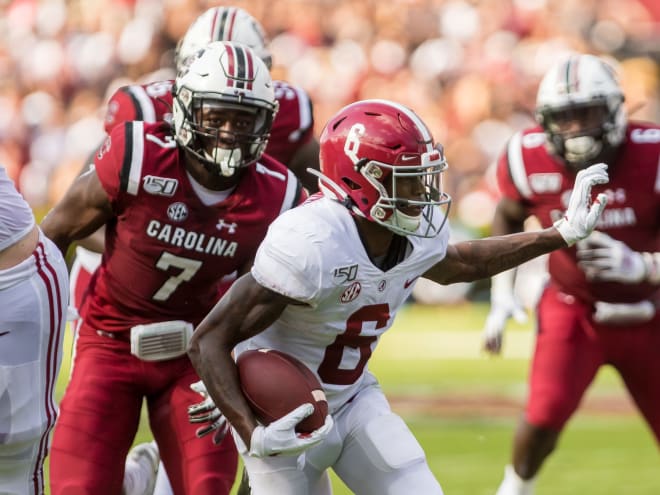 Jammie Robinson (No. 7) closes in on Alabama star receiver Devonta Smith during the 2019 season.