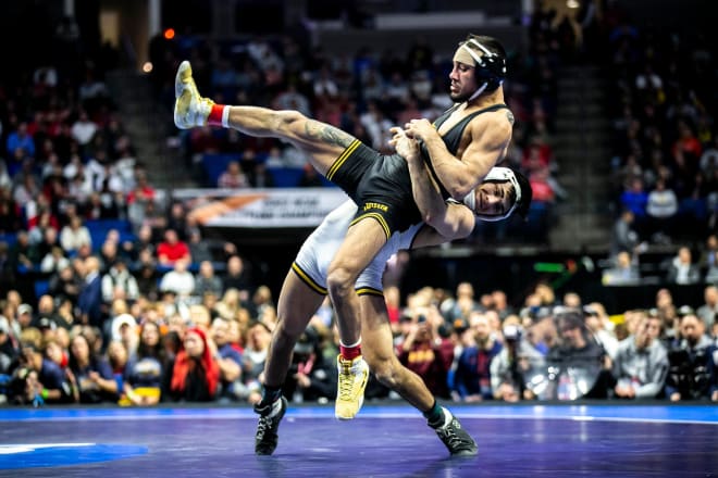 Iowa's Real Woods and Northern Colorado's Andrew Alirez battle in the NCAA final at 141 lbs.