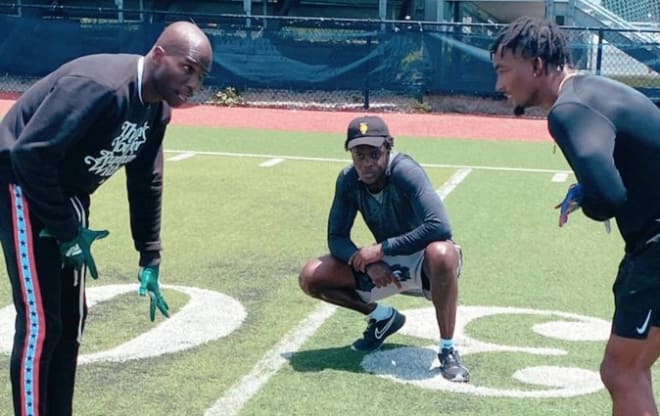 Ex-NFL star Chad Johnson (left) works out with former Florida cornerback C.J. Henderson (right) while Carolina Panthers QB Teddy Bridgewater (middle) watches.