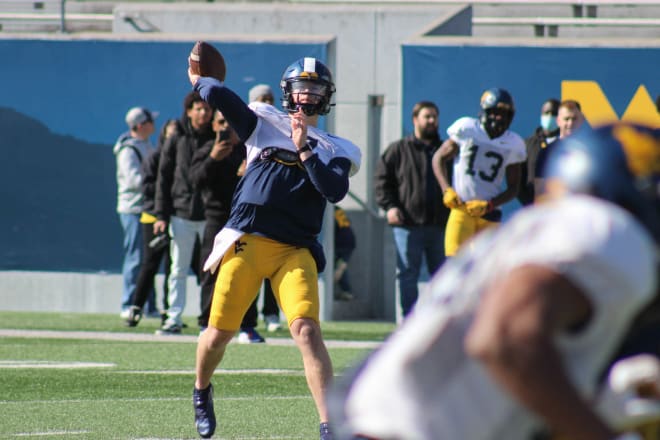 West Virginia quarterback Will "Goose" Crowder attempts a pass during practice on April 2.