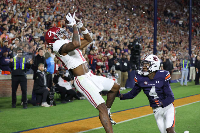 Alabama Crimson Tide wide receiver Isaiah Bond (17) scores the game winning touchdown over Auburn Tigers cornerback D.J. James (4) during the fourth quarter at Jordan-Hare Stadium. Photo | John Reed-USA TODAY Sports