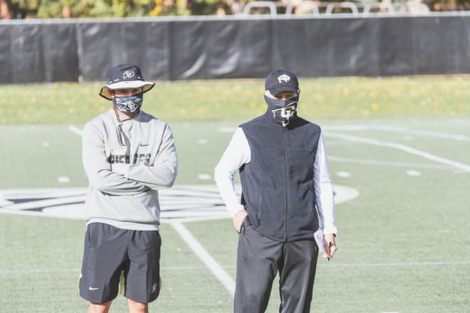 Bob Lopez (right), Colorado's director of player personnel, stands next to Chandler Dorrell, the Buffs' assistant director of player personnel. Both are frontline soldiers when it comes to CU identifying and courting recruits.