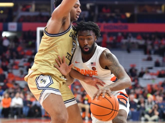 Feb 28, 2023; Syracuse, New York, USA; Syracuse Orange guard Symir Torrence (10) presses up against Georgia Tech Yellow Jackets guard Dallan Coleman (3) in the second half at the JMA Wireless Dome. Mandatory Credit: Mark Konezny-USA TODAY Sports