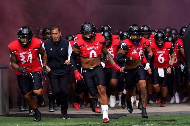 Sept. 24, 2022, Cincinnati, OH; Cincinnati Bearcats head coach Luke Fickell and the Cincinnati Bearcats take the field before the start a game against the Indiana Hoosiers at Nippert Stadium.