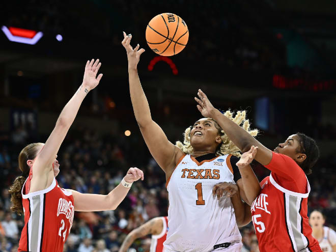 Texas center Lauren Ebo (1) tries to catch a pass between Ohio State's Tanaya Beacham, right, and Taylor Mikesell.