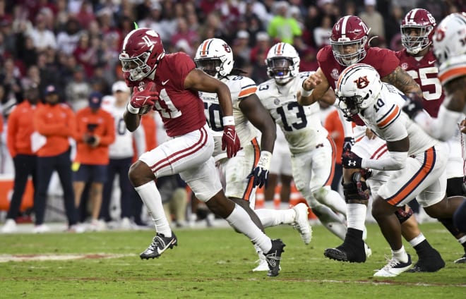 Alabama wide receiver Traeshon Holden (11) breaks away from Auburn defenders including Auburn safety Zion Puckett (10) and Auburn defensive lineman Marcus Harris (50) on his way to a touchdown at Bryant-Denny Stadium. Photo | Gary Cosby Jr.-USA TODAY Sports