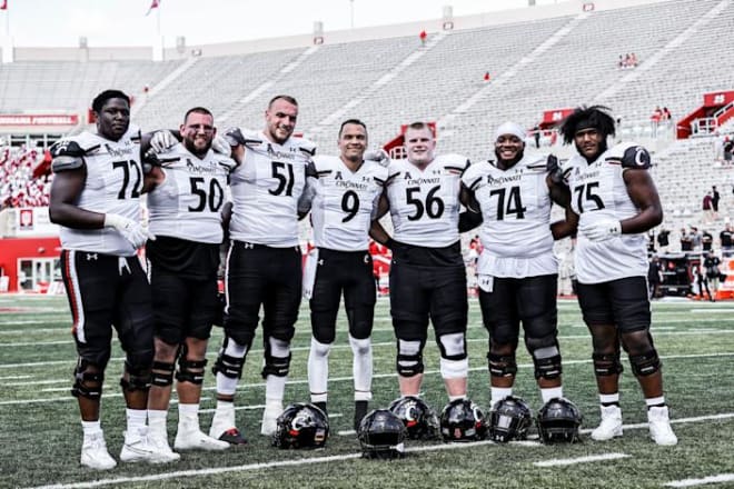 Desmond Ridder poses with his offensive line after Cincinnati's defeat of Indiana on Sept. 18. He told Yahoo Sports that he plans on taking another pic at Notre Dame Stadium on Saturday, saying, "these are places we get to play at once in a lifetime you know, for some of us once in a lifetime, whatever. So, you know, just really cherish the moment and in pregame speeches it was: live in the moment, be in the moment, be present, don't be anywhere else and don't take anything for granted."