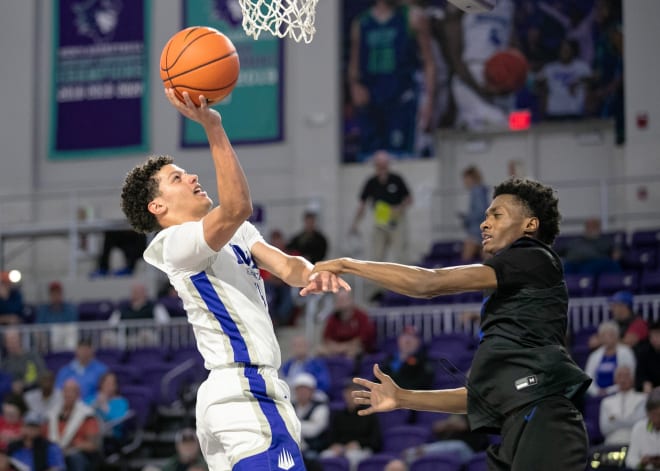 Felipe Quinones of IMG Academy is guarded by Dorian Jones of Richmond Heights in the City of Palms Classic on Wednesday, Dec. 20, 2023, at Suncoast Credit Union Arena in Fort Myers.