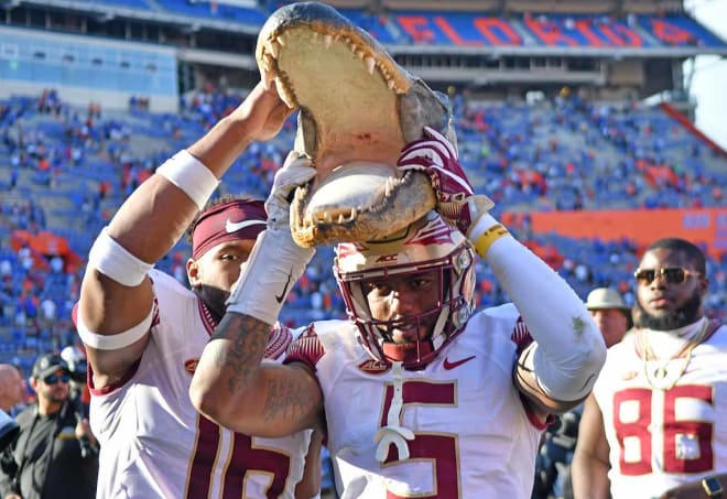 Former FSU receiver/defensive back Ermon Lane shows off a 'gator head after a Seminoles victory in Gainesville.